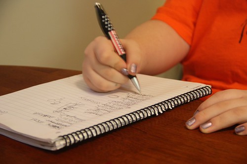 writing in spiral notebook